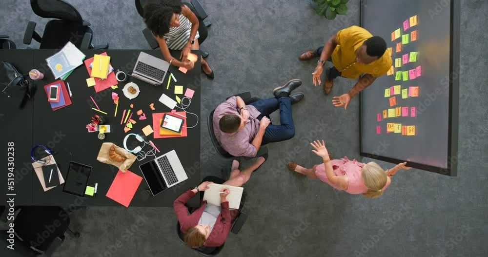 Poster overhead view of creative team in a meeting brainstorming ideas. professional colleagues working tog