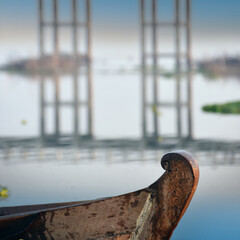 traditional fisherman boat at the historic wooden U Bein Bridge  near Mandalay in Myanmar