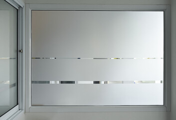 Aluminium sliding window of office. office sliding glass window. Decorative Glass Film on door of...