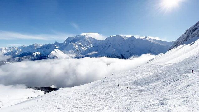 Valley in Alps mountains Mont Blanc massif with clouds bellow
