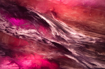 Macro detail charoite, close-up of a textured semi-precious gemstone background. backlight transparency