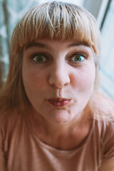 funny woman face distorted angle