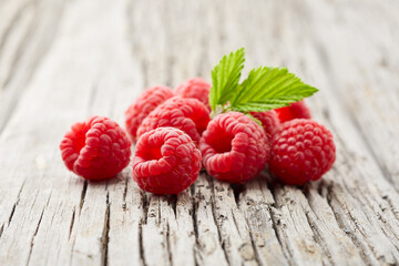 Raspberry on old wooden background