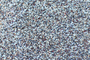 glittering background of silver sequins closeup. Sparkle festive texture