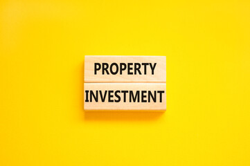 Property investment symbol. Concept words Property investment on wooden blocks on a beautiful yellow table yellow background. Business Property investment concept. Copy space.