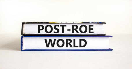 Roe vs Wade post-Roe world symbol. Concept words Post-Roe world on books on a beautiful white table...
