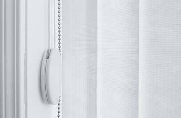 Vertical window blinds detail. Light and airy shot.