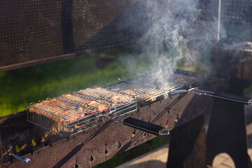 cooking meat grill on fire on the grate	
