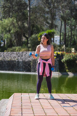 Young woman doing different sports activities, outdoors in a park.