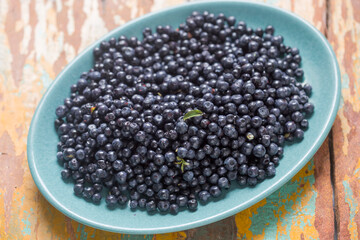 Fresh blueberries in blue bowl