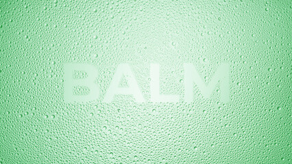 Writing balm printed on the wet glass on green background | balm commercial concept