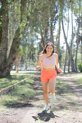 Young woman doing different sports activities, outdoors in a park.