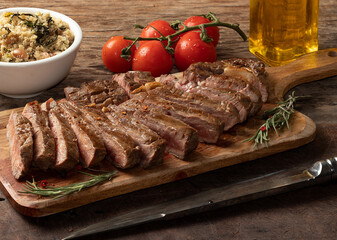Brazilian barbecue. Grilled beef served with toasted manioc flour.