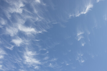 Light clouds are blown like sand
