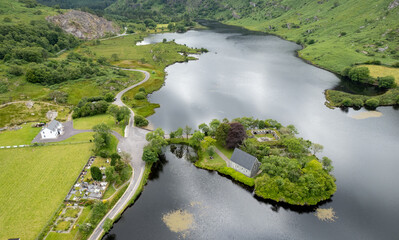 Aerial drone landscape of St. Finbarr oratory Church, Gougane Barra, cork West Ireland.