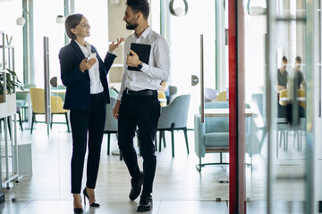 Business partners talking at the office