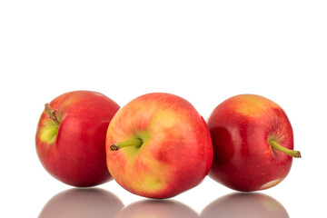 Fototapeta na wymiar Three red sweet apples , close-up, on a white background.