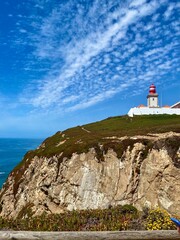 Fototapeta na wymiar lighthouse on a cliff, Colares, Portugal