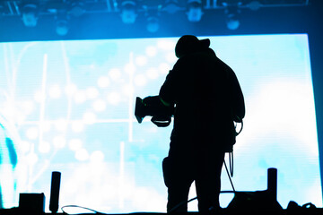 cameraman silhouette in stage lights