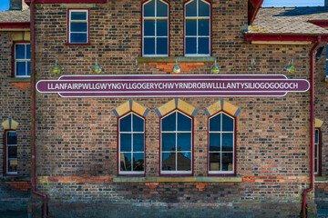 Fototapeta na wymiar Old train station building in Llanfair­pwllgwyngyll­gogery­chwyrn­drobwll­llan­tysilio­gogo­goch (the longest town name in Europe) on the wall. Anglesey, Wales
