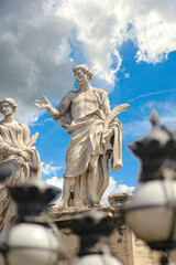 St. Peter`s Basilica Cathedral`s Dome with a statue of one of the apostles.