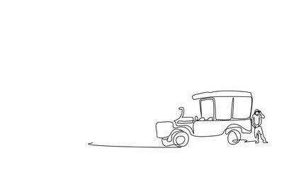 On a safari tour in African countries, a man explores the surroundings with binoculars next to a safari all-terrain vehicle.