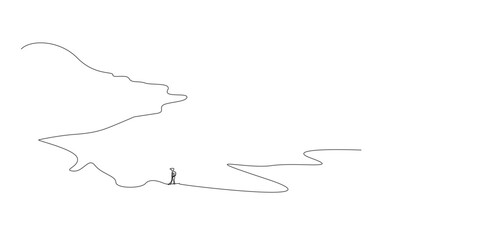 Fototapeta premium remote view of a person walking on the mountain road in nature