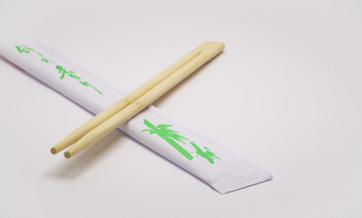 individual chopsticks for sushi in a package on a white background