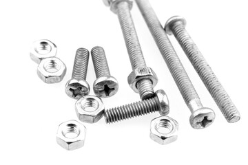 Group of screw-bolts isolated on white. Standing out of the crowd concept.