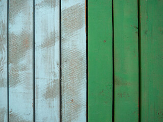 Colored wood flooring. Knocked together boards of blue and green colors.  Board background
