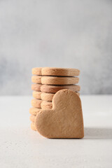 Valentine's Day homemade heart shaped cookies on white background. Vertical format. Close up.