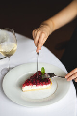 Tart with raspberry coulis. Dessert on a white plate
