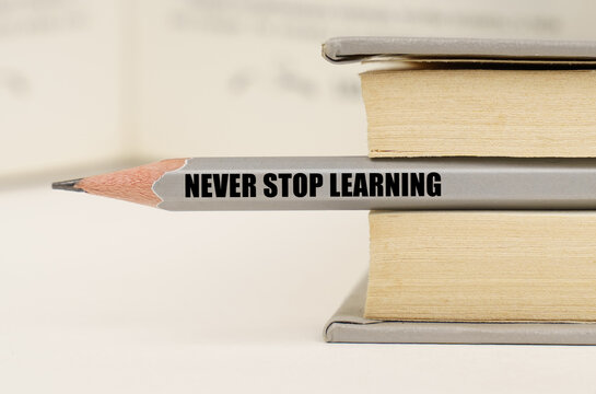 In the book between the pages lies a pencil with the inscription - Never stop learning