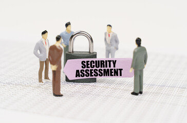 There are figures of people on business reports, a padlock with a sticker on which it is written -...