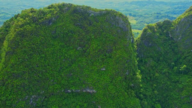 A drone is flying over "Khao Thalu" in Chumphon province. famous tourist attractions in southern Thailand. 4k. travel in thailand concept
