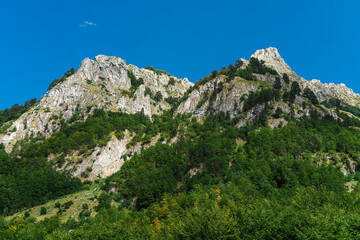 Montenegro. Prokletiye National Park. Summer. Mountain range. Green mountain peaks