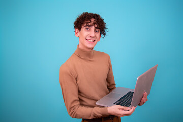 Cheerful funny student with a laptop.	