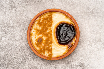 Turkish dessert.  Rice pudding with cinnamon on the vintage background 
