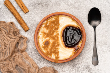 Turkish dessert.  Rice pudding with cinnamon on the vintage background 