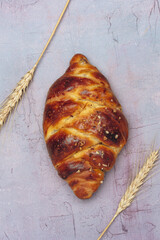 Homemade braided Challah bread on vintage background