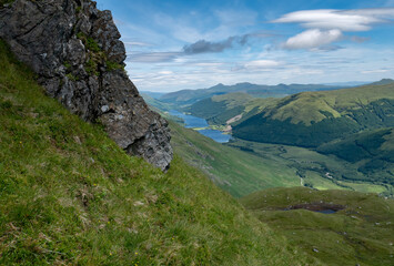 Scenic view of lake loch voil from a hill called beinn tulaichean, beautiful green hilly Scottish landscape