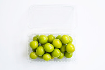 fresh green plum on a white background