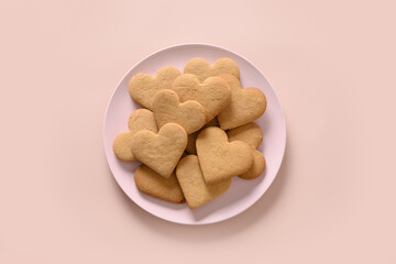Valentine's Day heart shaped cookies isolated on pink background. Top view.