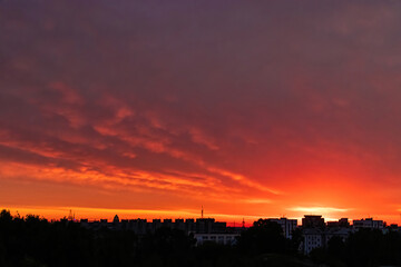 Fototapeta na wymiar Beautiful clouds in early morning. Sun rising over city.