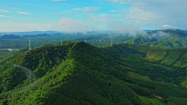 Aerial view from a drone flying over the view of Green Mountains at Khao Ong, Chumphon Province, Southern Thailand. Tropical forest. Rainy season. travel in thailand concept. 4k
