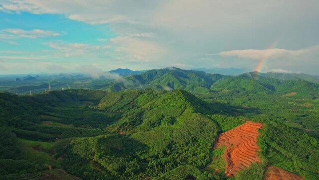 Aerial view from a drone flying over the view of Green Mountains at Khao Ong, Chumphon Province, Southern Thailand. Tropical forest. Rainy season. travel in thailand concept. 4k
