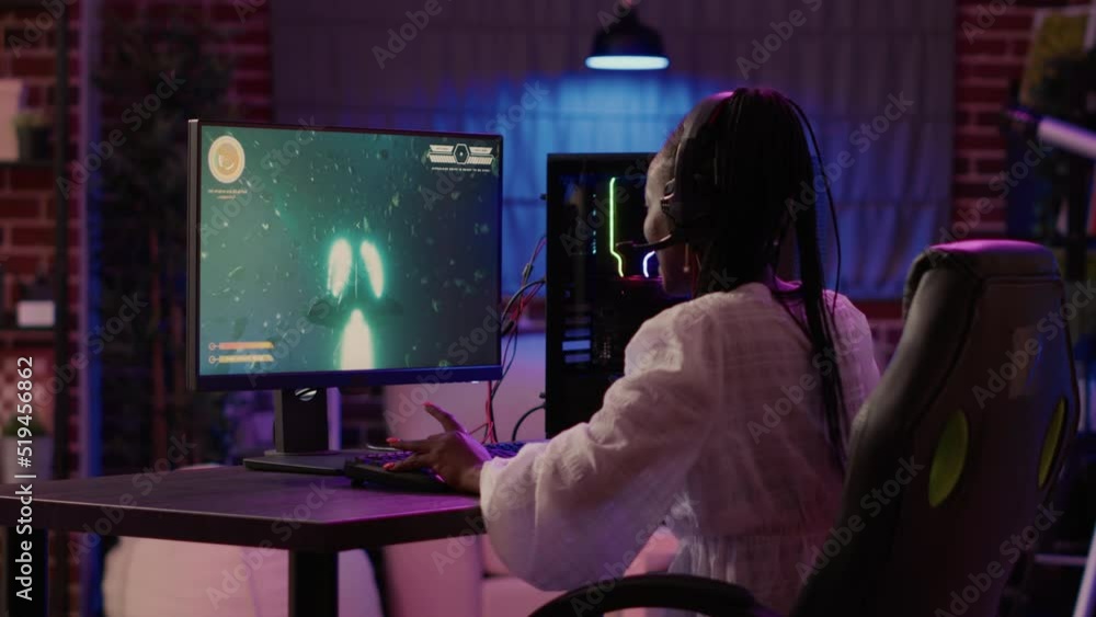 Aufkleber woman playing multiplayer space shooter simulation enjoyingh free time using pc gaming setup in home
