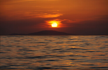 An abstract representation of a seascape in the intense red color of a sunset