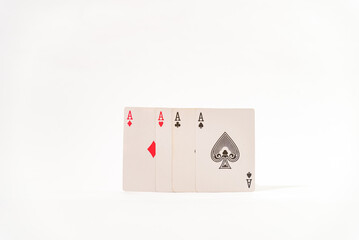 aces of both colors on white table