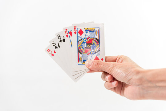 hand with shuffled cards, white background